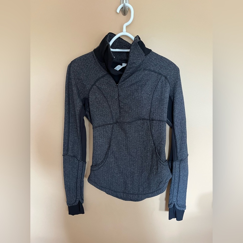 Size 4 Lululemon half zip. Greyish black.